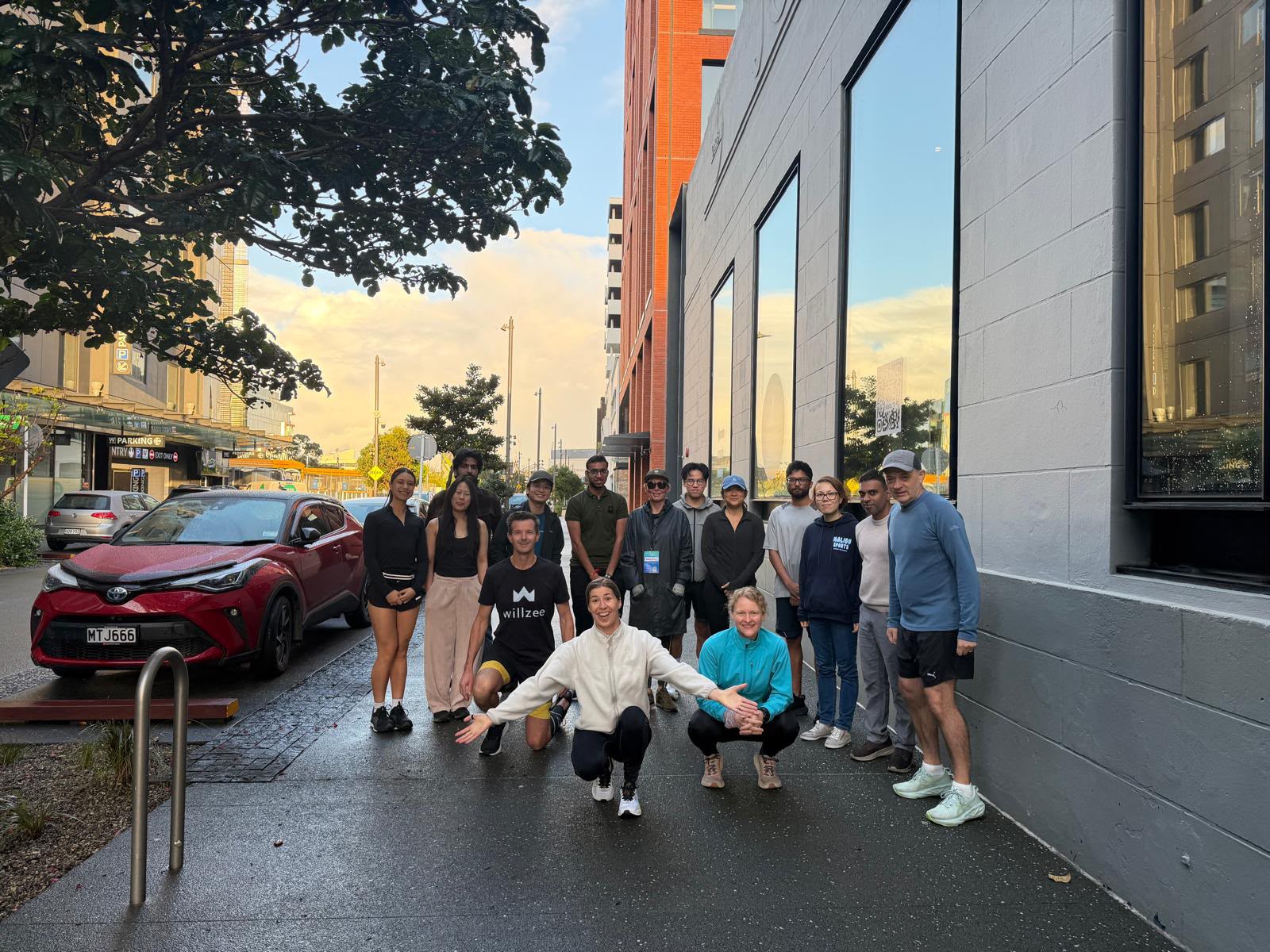 A group of Lineup members gathered on a city street after a morning meetup
